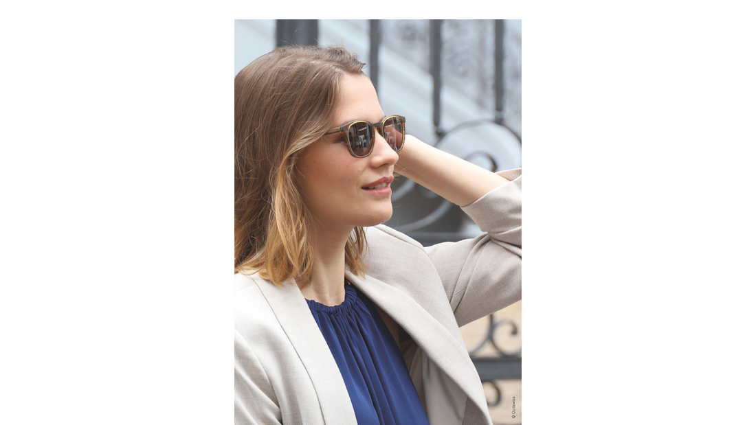 Femme portant des lunettes de soleil à verres dégradés de qualité - Rétine & Pupille Opticiens Paris 17